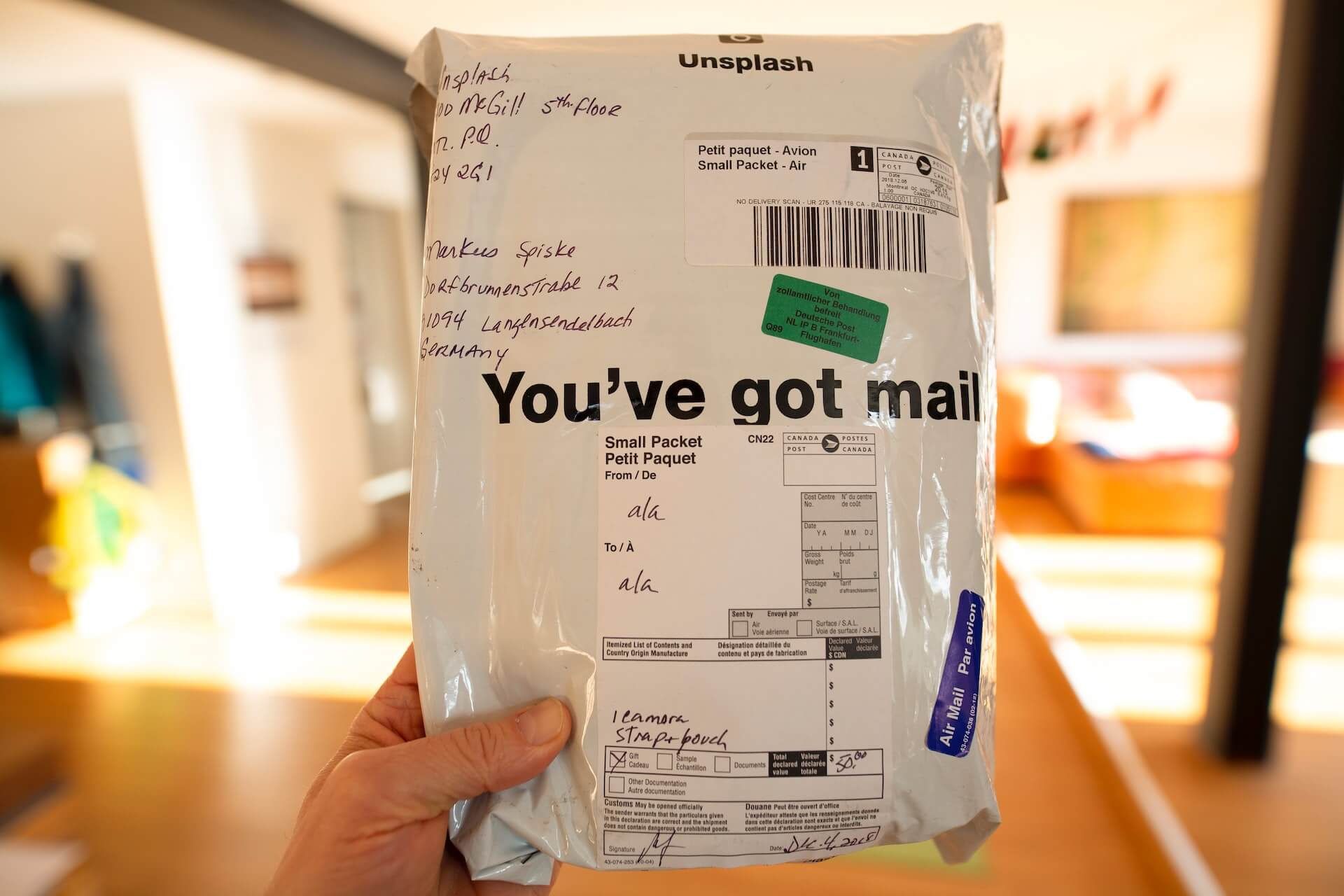 Package with "You've got mail" written on it